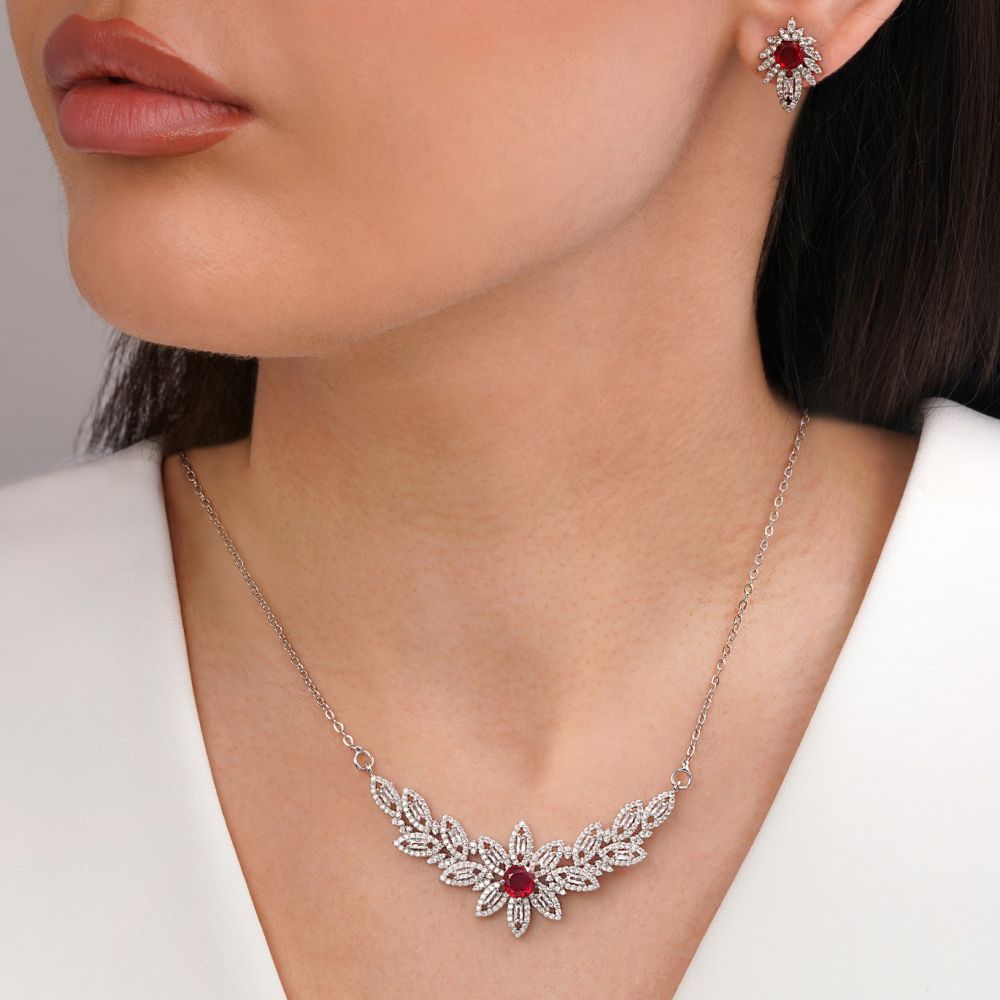 تصویر نیم ست جواهری نگین قرمز تیتانیوم نقره ای