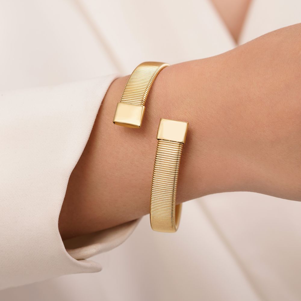 تصویر دستبند النگویی استیل 316 طرح دار طلایی(فری سایز)