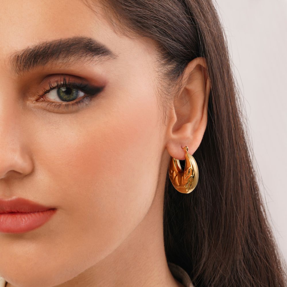 تصویر گوشواره استیل 316 حلقه ای طرح دار طلایی